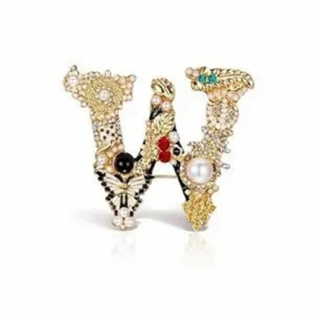 ?? Elegant Gold and Black Embellished Brooch